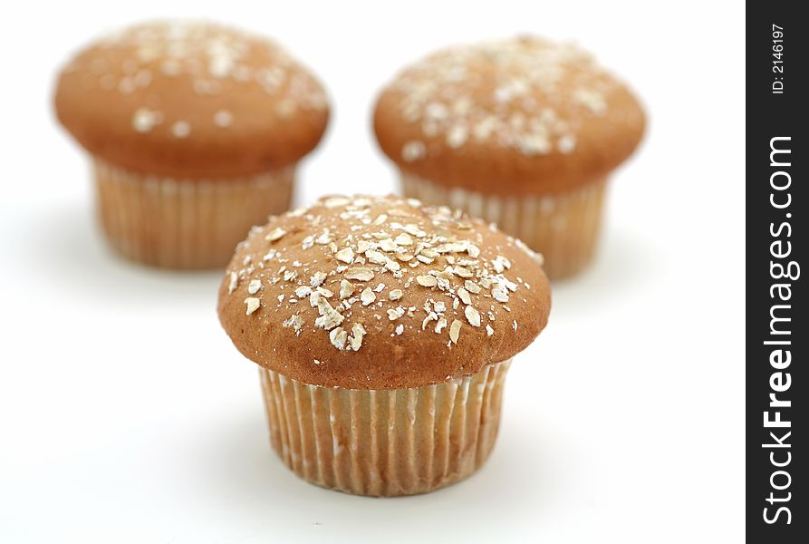 Raspberry muffins over the white background