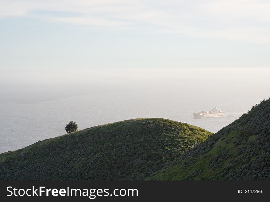 View over hills of a container ship. View over hills of a container ship