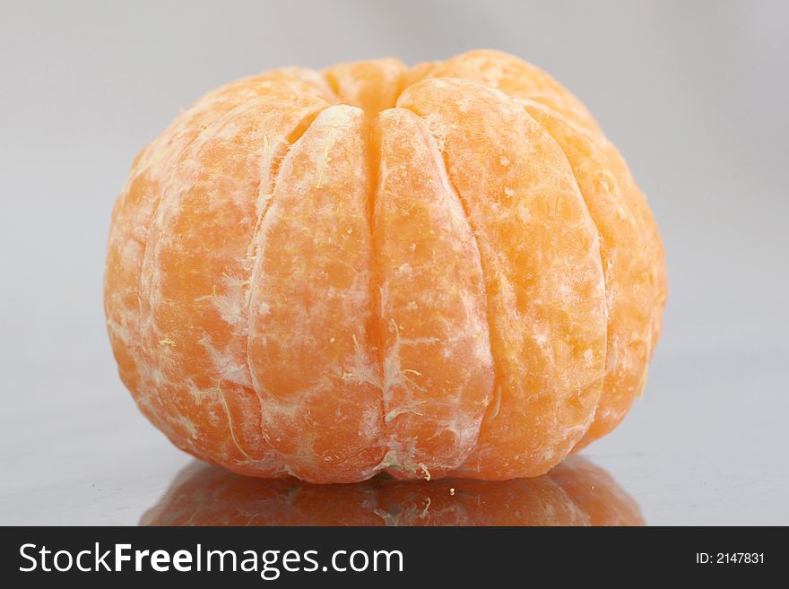 A peeled mandarin showing its wedge shaped segments. A peeled mandarin showing its wedge shaped segments