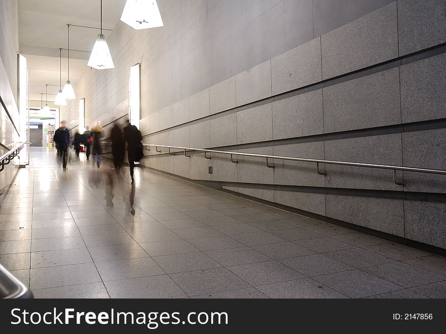 Corridor to subway with people motion blur