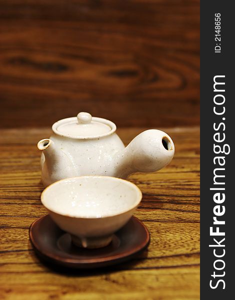 White Asian tea pot and cup - home interiors. White Asian tea pot and cup - home interiors