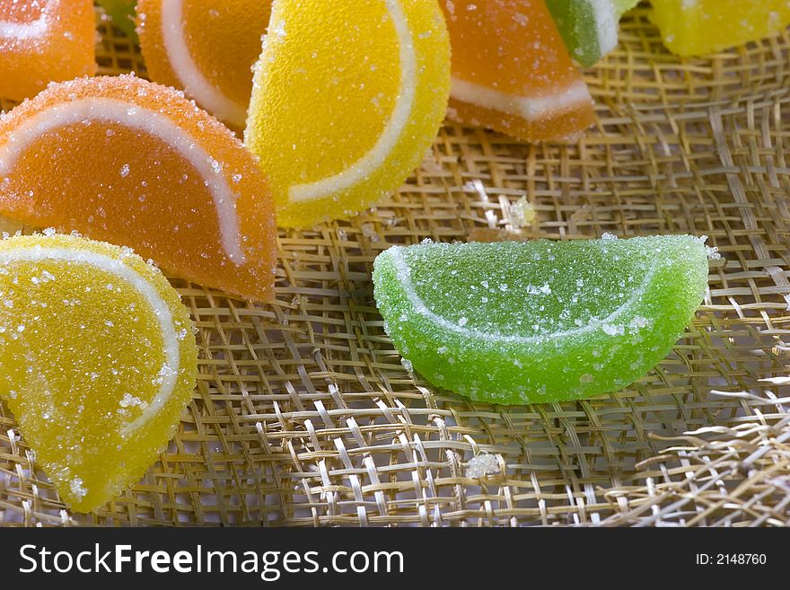 A photo of orange, green and yellow marmalade. A photo of orange, green and yellow marmalade