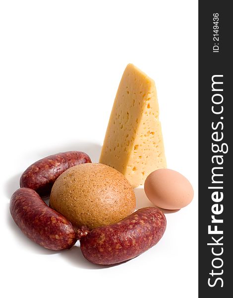 Bread, cheese, egg and sausages on white background. Bread, cheese, egg and sausages on white background