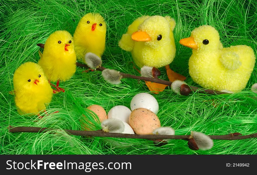 Three chickling and two duckling  decorated on green grass. Three chickling and two duckling  decorated on green grass