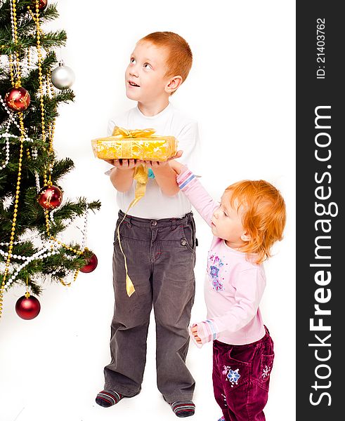 Children decorate a new-year tree on a white background