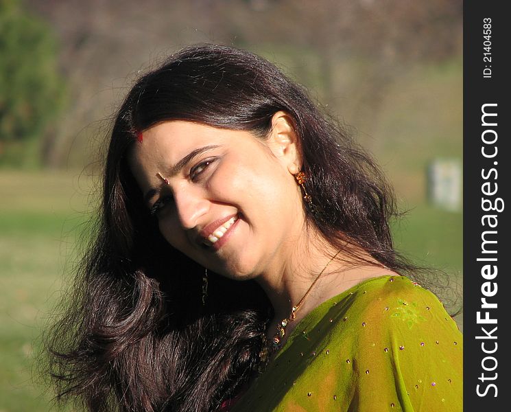 Beautiful Young Indian Married woman in traditional dress and jewelry smiling. Beautiful Young Indian Married woman in traditional dress and jewelry smiling.