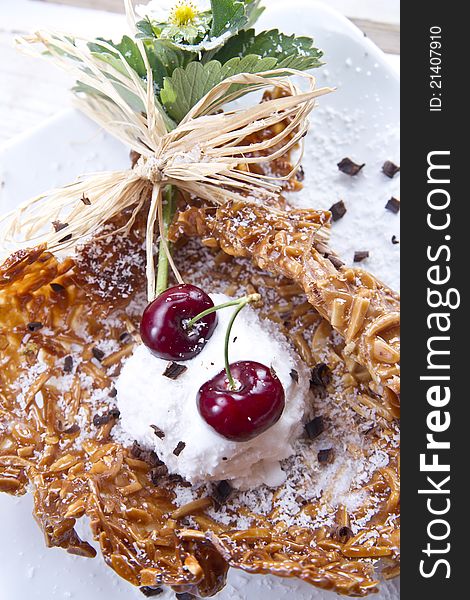 Waffle ice cream dessert made ​​with coconut and cherries. Waffle ice cream dessert made ​​with coconut and cherries