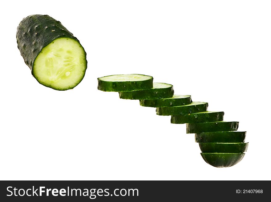 Cucumber half cut and slices isolated over white background. Cucumber half cut and slices isolated over white background.