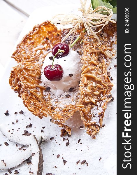 Waffle ice cream dessert made â€‹â€‹with coconut and cherries. Waffle ice cream dessert made â€‹â€‹with coconut and cherries