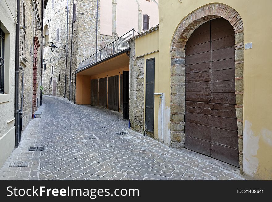Garage on medieval street in Italian city of Camerino at 200 km north to Rome