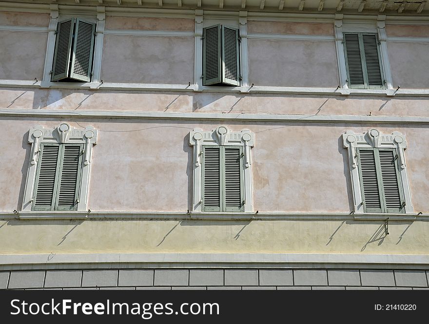 Six windows on red wall