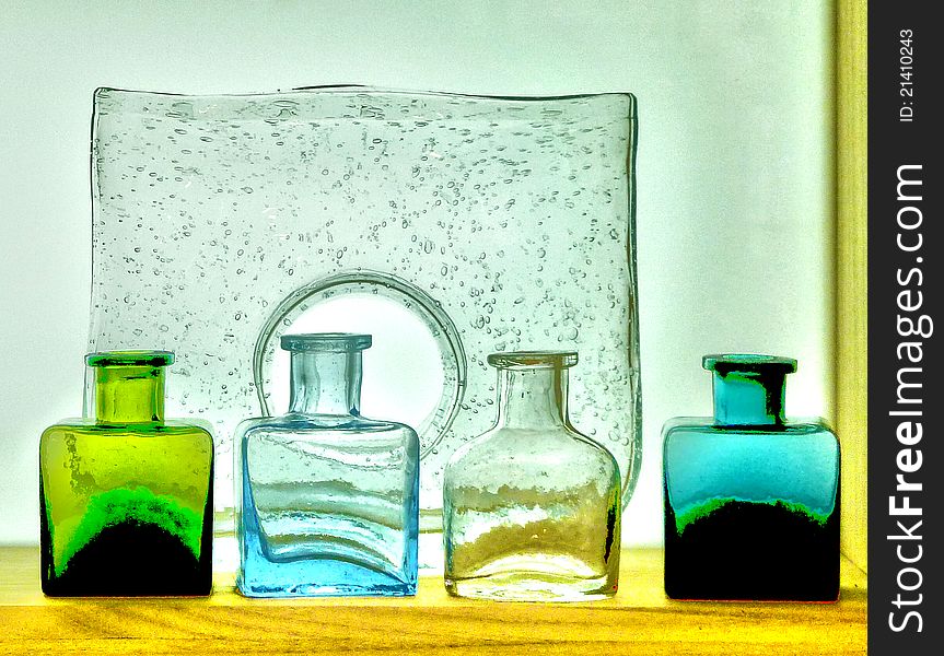 Colorful glass bottles on shelf