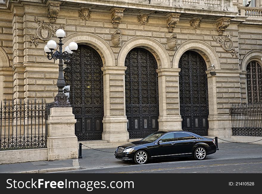 Luxury car waiting in front of a modern building