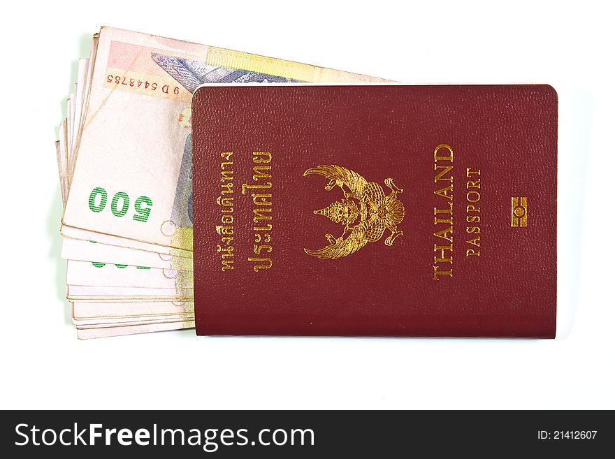 Thailand passport and Thai money on white background