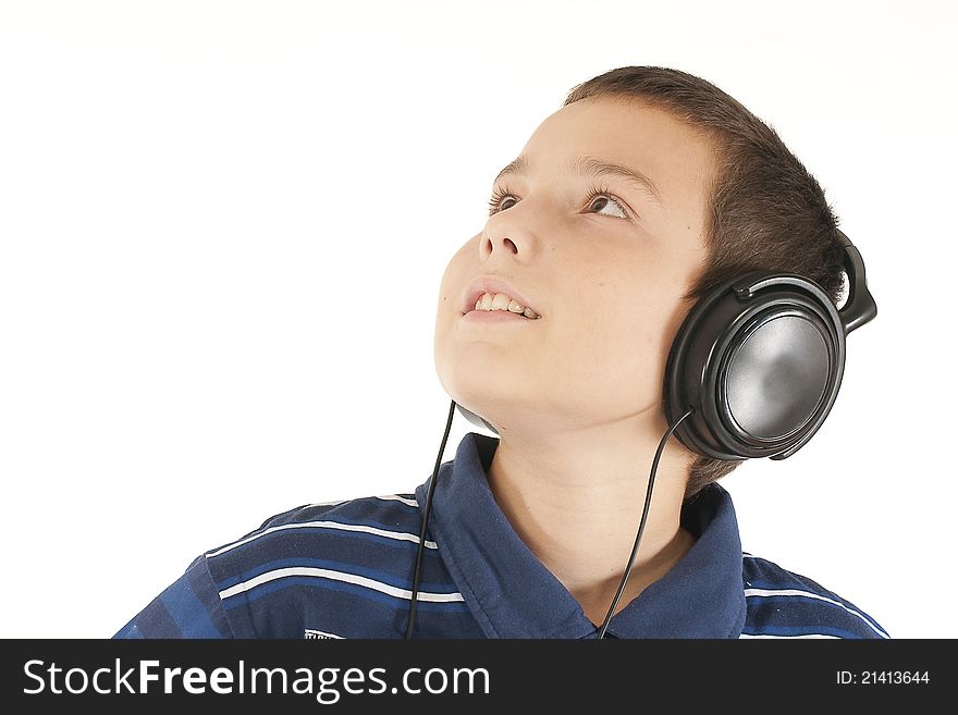 The eleven-year teenager listens to music in ear-phones. The eleven-year teenager listens to music in ear-phones