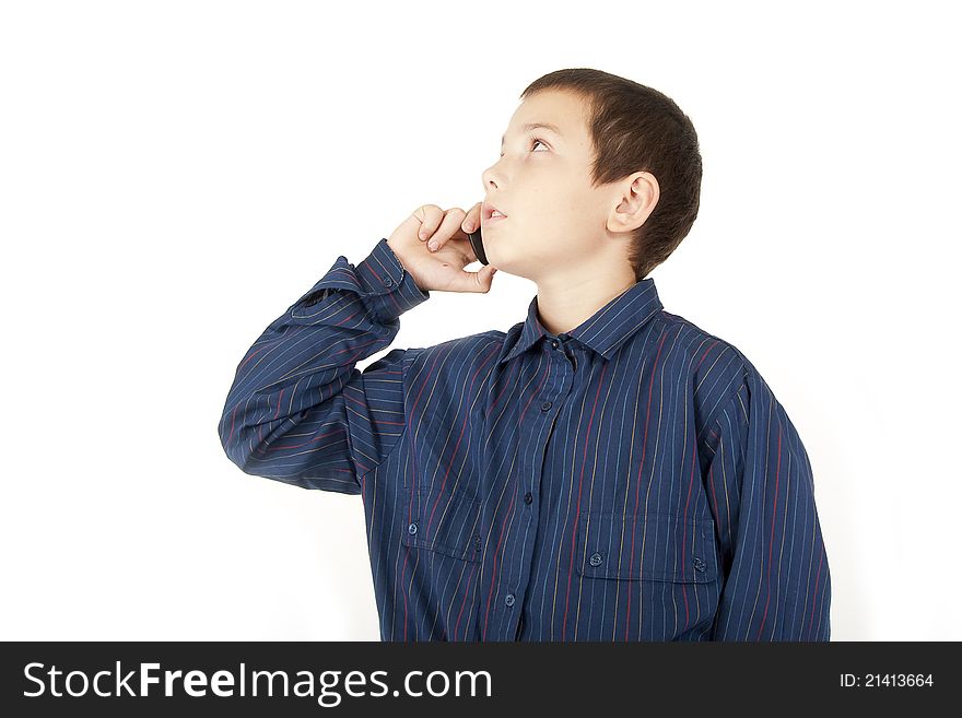 The young eleven-year teenager talks by a mobile phone. The young eleven-year teenager talks by a mobile phone