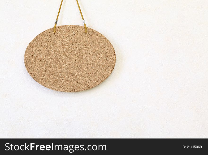 Blank cork board hang on the wall background