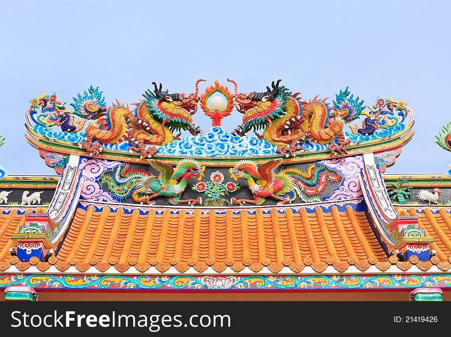 Chinesse dragon statue on blue background. Chinesse dragon statue on blue background