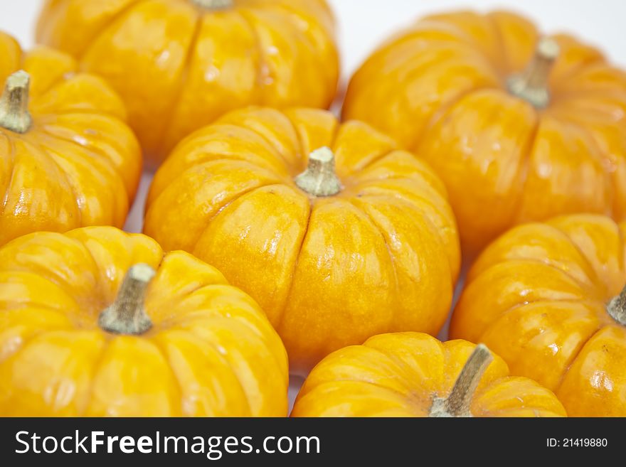 Various of orange pumpkins on a white background