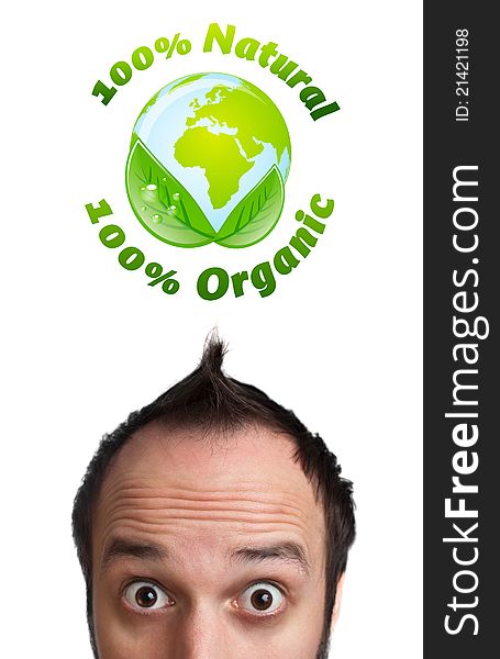 Young persons head looking at green eco sign. Young persons head looking at green eco sign