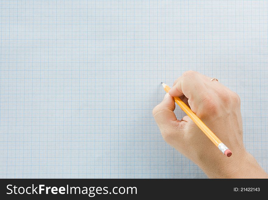 Hand writing by pencil on blue graph grid paper