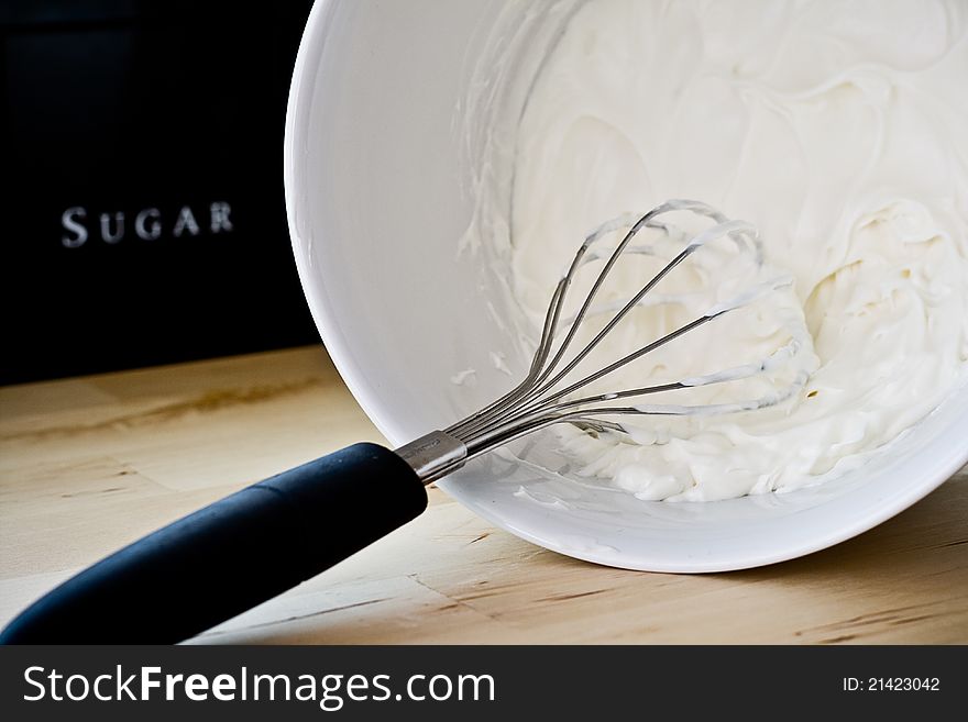 White bowel for mixing cream to make desert