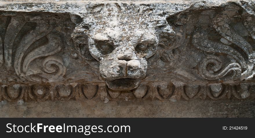 Ancient lion's head carved in stone, in Ephesus - Turkey.