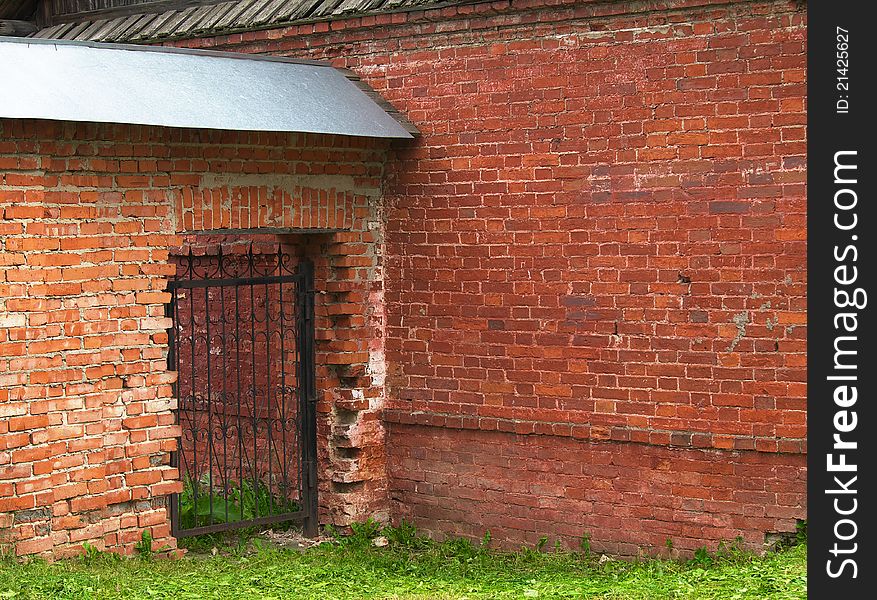 Openwork Gate In The Brick Wall