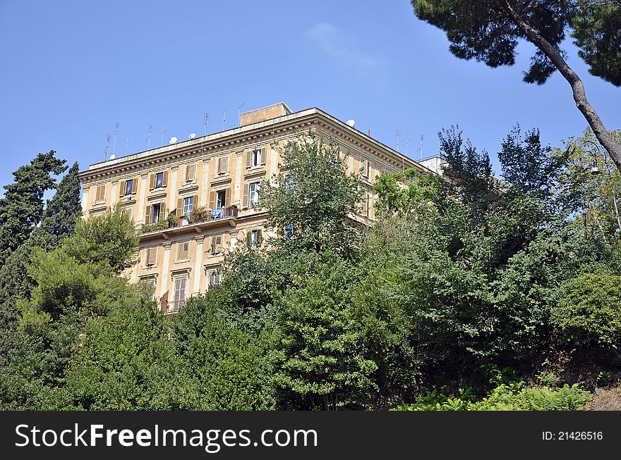 Green place in front of modern building in the center of Rome