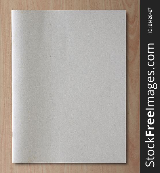Gray recycled notebook on wood background