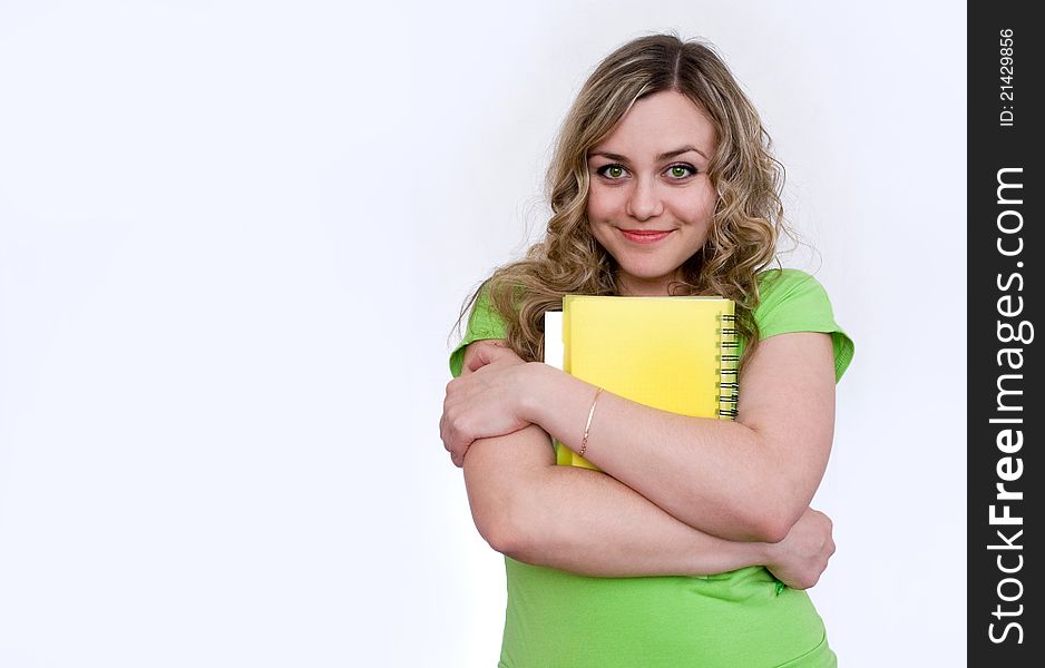 Woman in the green jersey with a notebook. Woman in the green jersey with a notebook