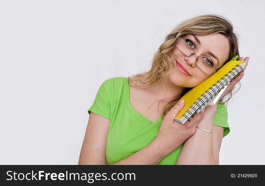 Woman in the green jersey with a notebook. Woman in the green jersey with a notebook