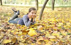 Girl Lying On Fall Leaves Outdoors Royalty Free Stock Image Girl Lying On Fall Leaves Outdoors Royalty Free Stock Image