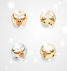Four Glass Spheres With Funny Christmas Reindeers Stock Photo