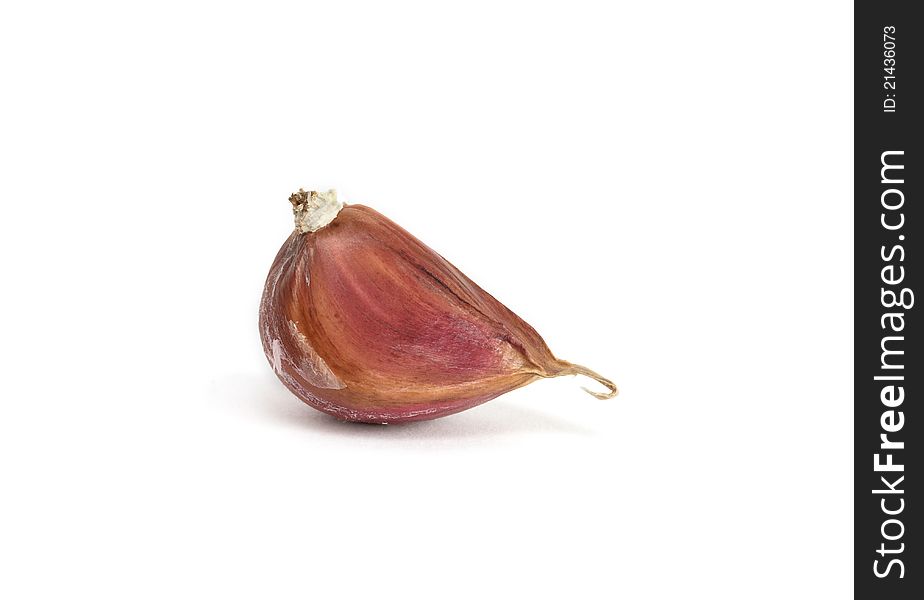 One clove of garlic on white background