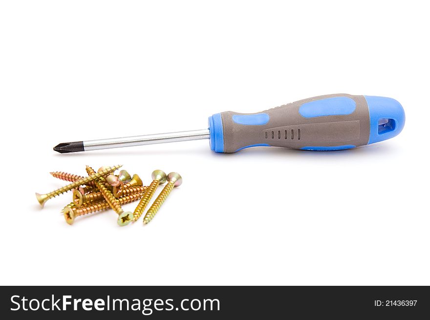 Screwdriver and yellow screws on white background