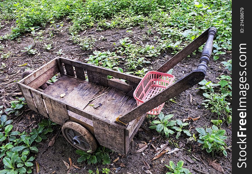 Makeshift wooden cart from junk parts.