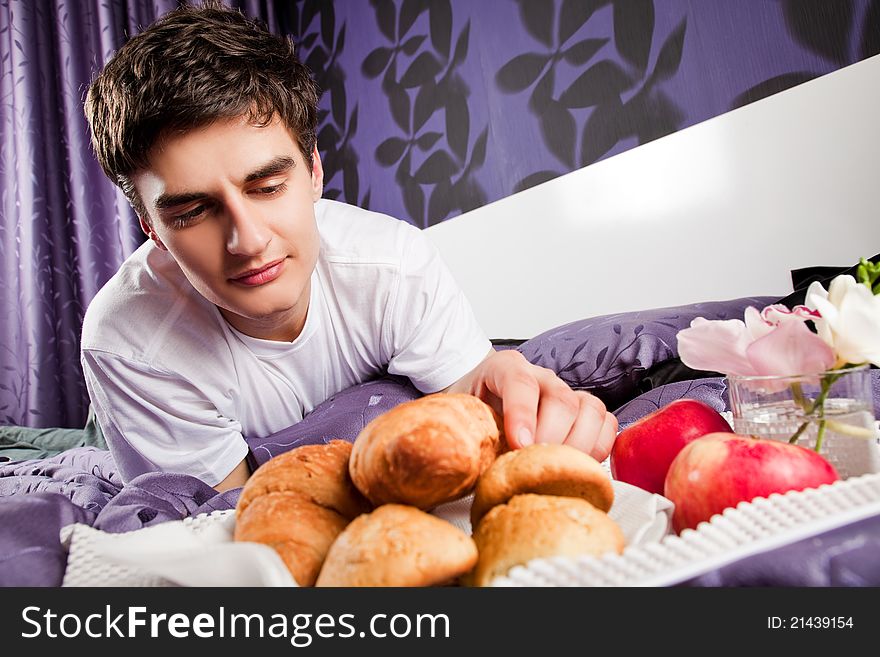 Male Having Breakfast In Bed