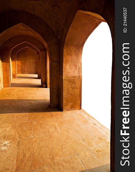 Part of ancient architecture. Corridor with arches constructed from terracotta stones. Copy space for text. Part of ancient architecture. Corridor with arches constructed from terracotta stones. Copy space for text