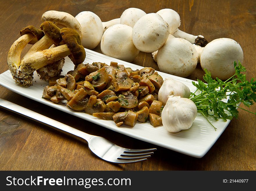 Cooked and fresh mushrooms  with garlic and parsley