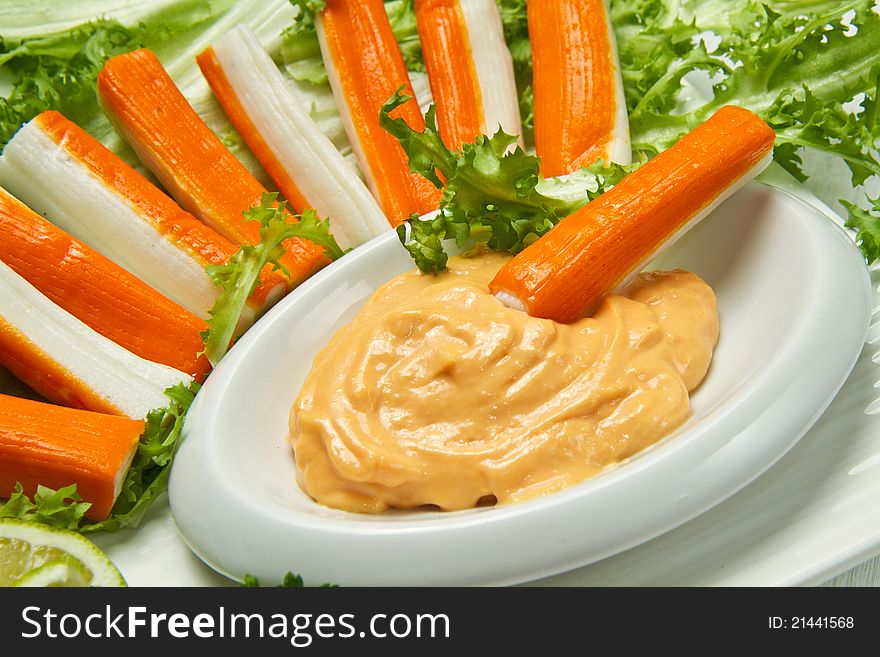 Crab salad with fresh lettuce and cocktail sauce