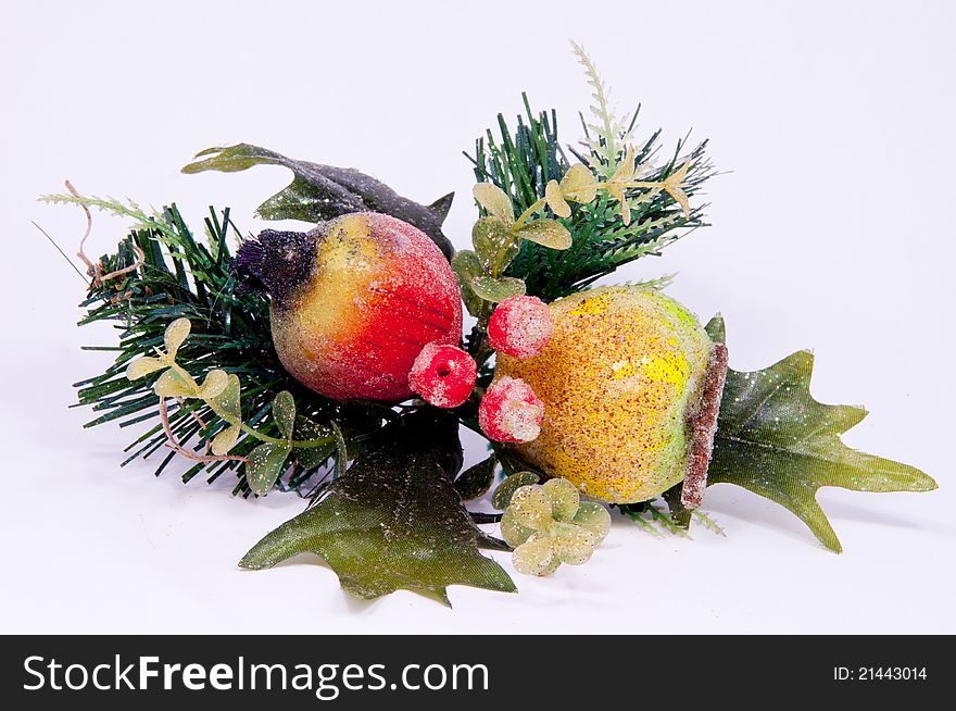A cluster of leaves and fruit used for holiday decorations. A cluster of leaves and fruit used for holiday decorations.