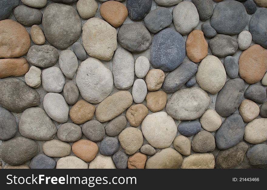 Multicolor different size Stones with cement on wall. Multicolor different size Stones with cement on wall