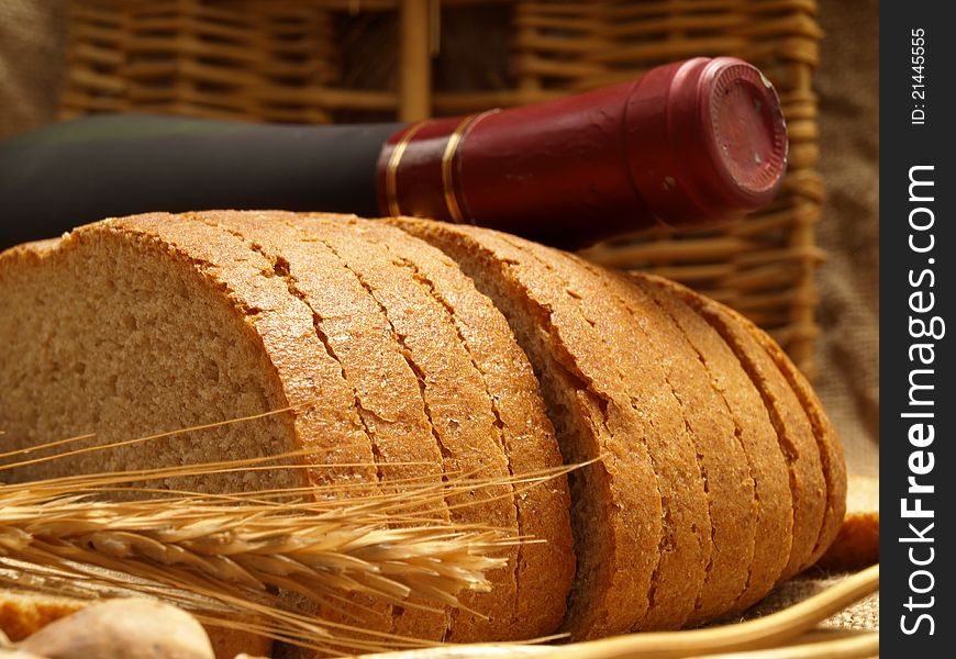 Assortment of baked bread on wood table. Assortment of baked bread on wood table