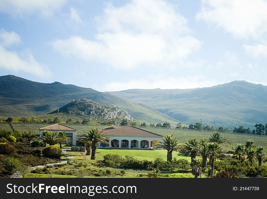 Summer villa hotel resort with moutains and vineyards as backdrop. Summer villa hotel resort with moutains and vineyards as backdrop