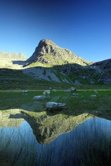 Tall Mountain Peak Reflected, Troms County, Norway Royalty Free Stock Images Tall Mountain Peak Reflected, Troms County, Norway Royalty Free Stock Images