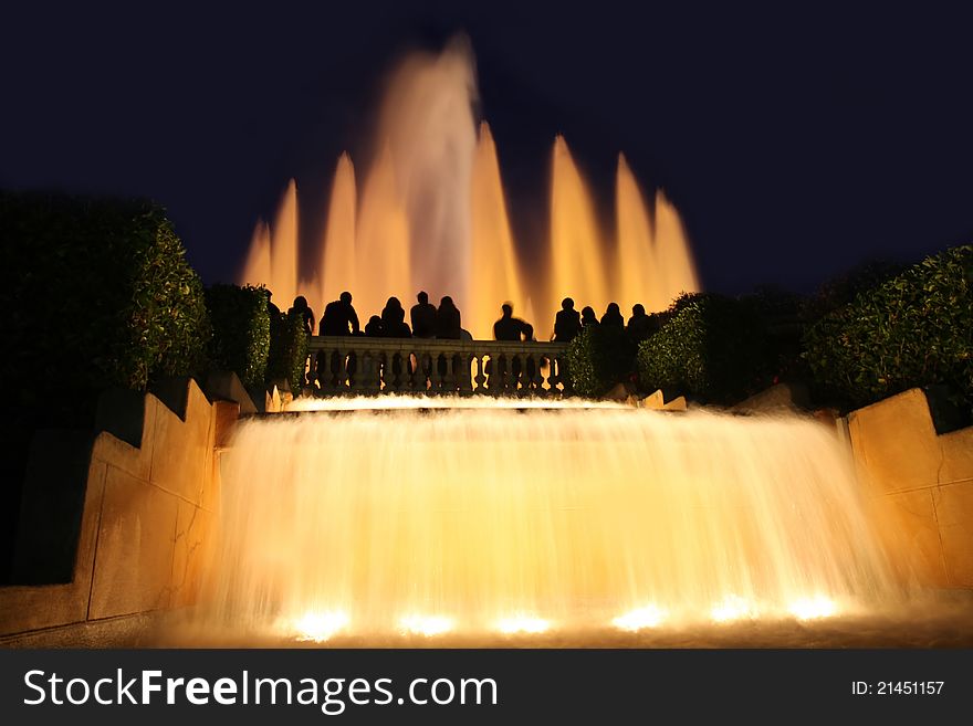 Details group tourists photographing fountain in city Barcelona, Spain