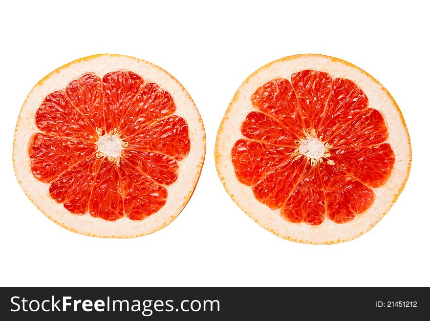Two grapefruit slices isolated against white