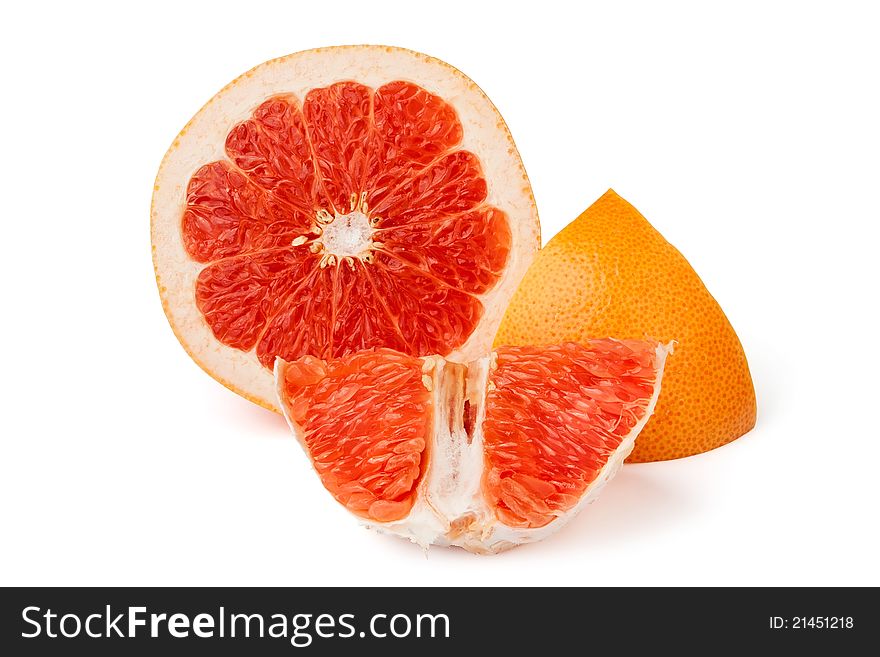 Cut grapefruit and its peel against white