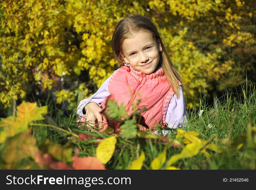 Girl Resting In The Autumn Park